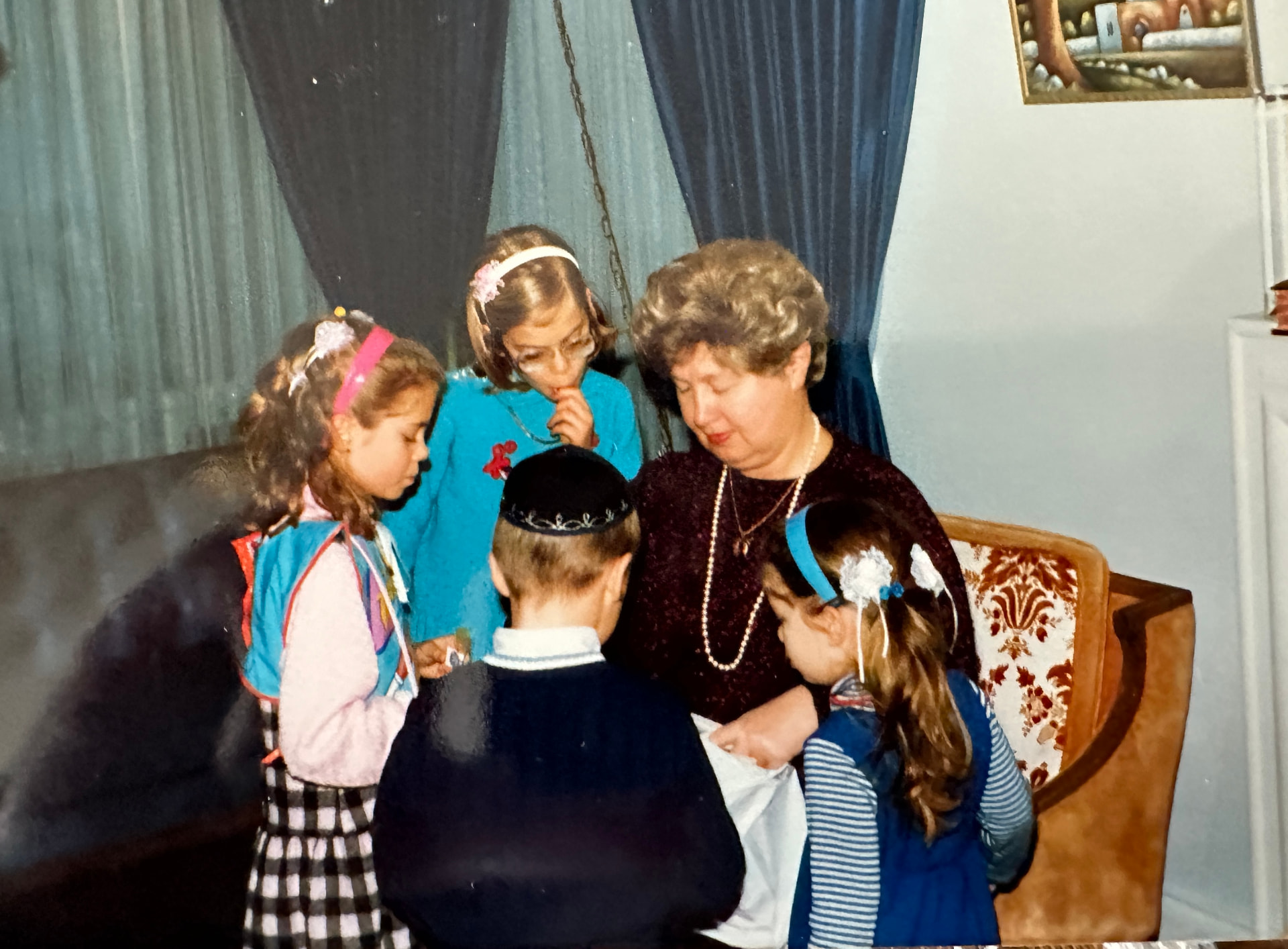 Bobby handing out treats to the grandchildren in the living room