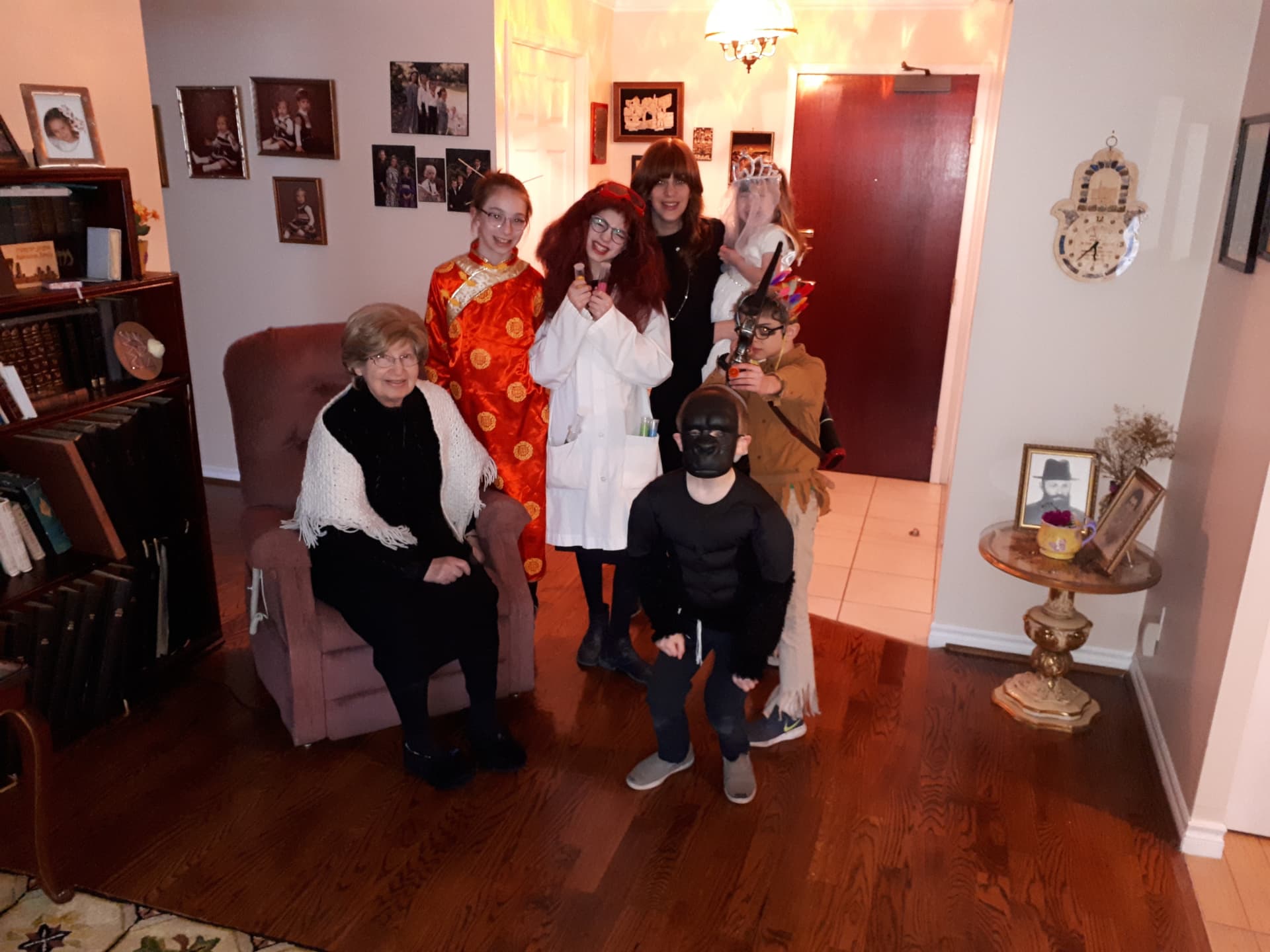 Another Purim gathering with costumed grandchildren around Bobby